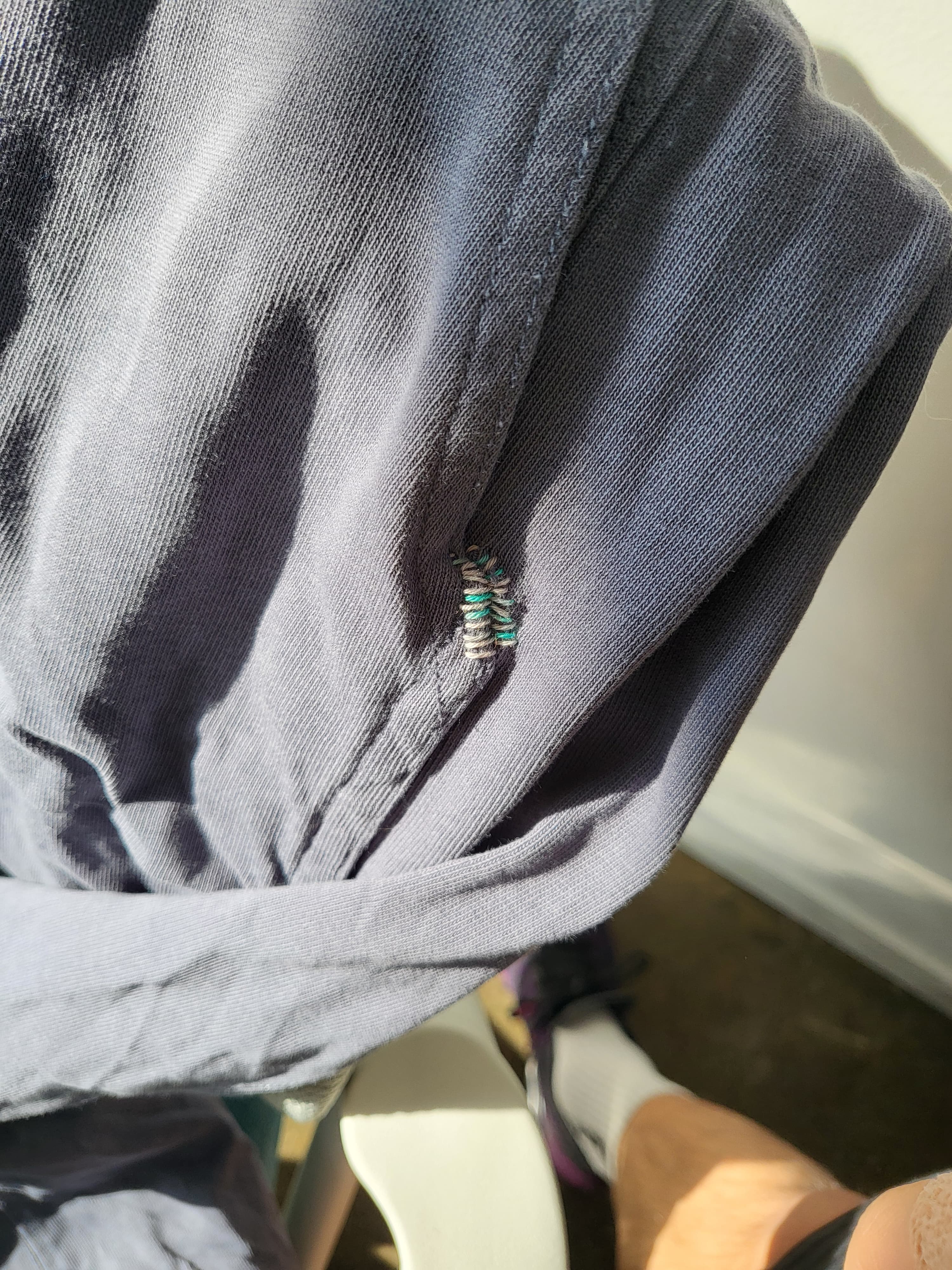 Blanket stitch complete — white and mint thread adds an unexpected accent