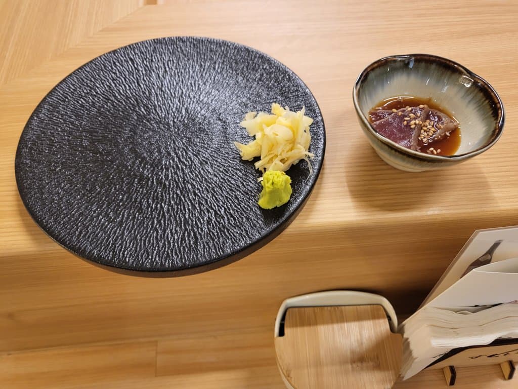 Basic setting — fresh wasabi, pickled ginger, and marinated tuna