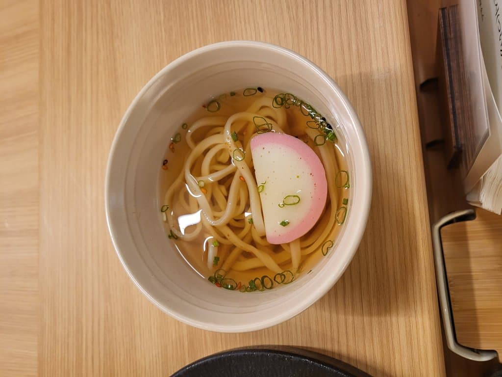 Udon — clear broth with naruto fish cake